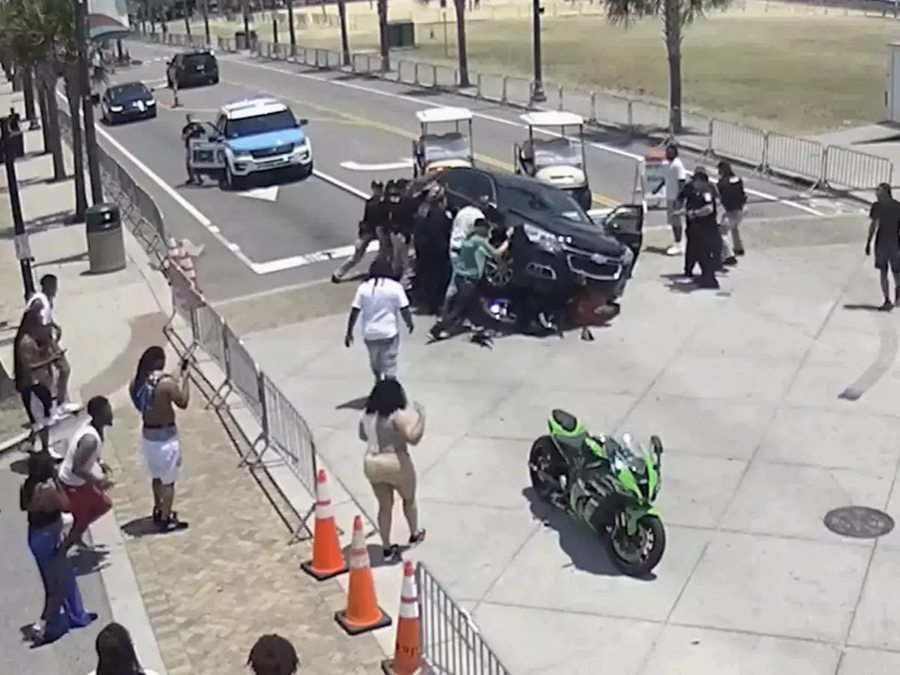 Motorcycle Accident Leaves Rider Trapped Underneath Car